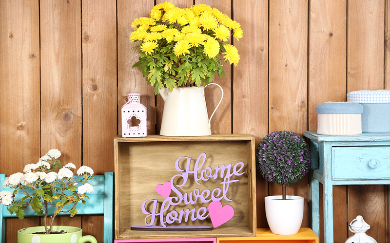 bright-yellow-flowers-in-a-vase-with-home-sweet-home-sign